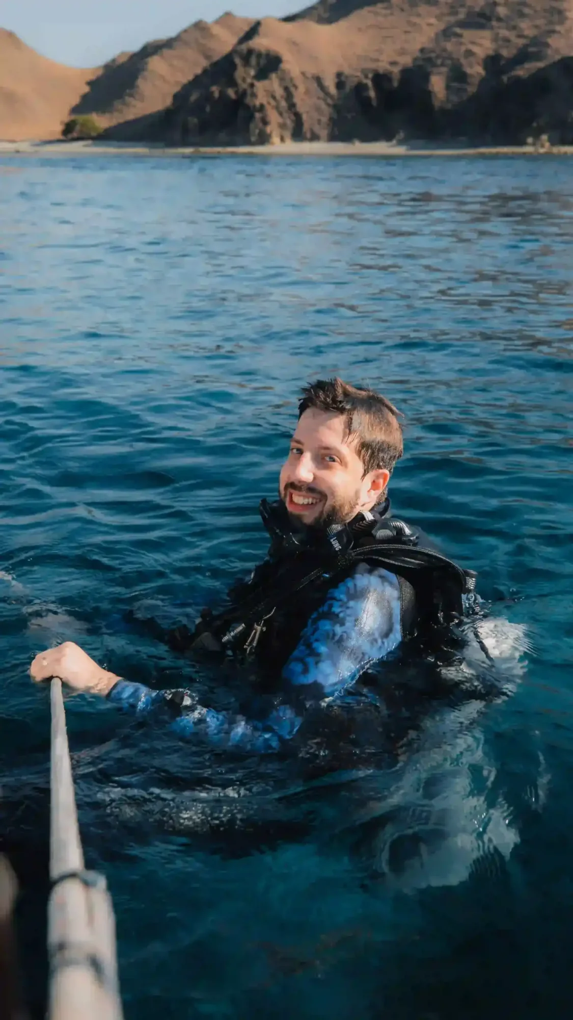 scuba diver in indonesia smiling after diving