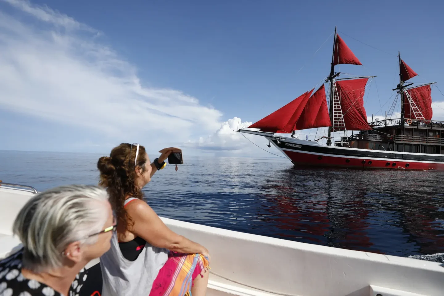 guests taking picture of la galigo liveaboard